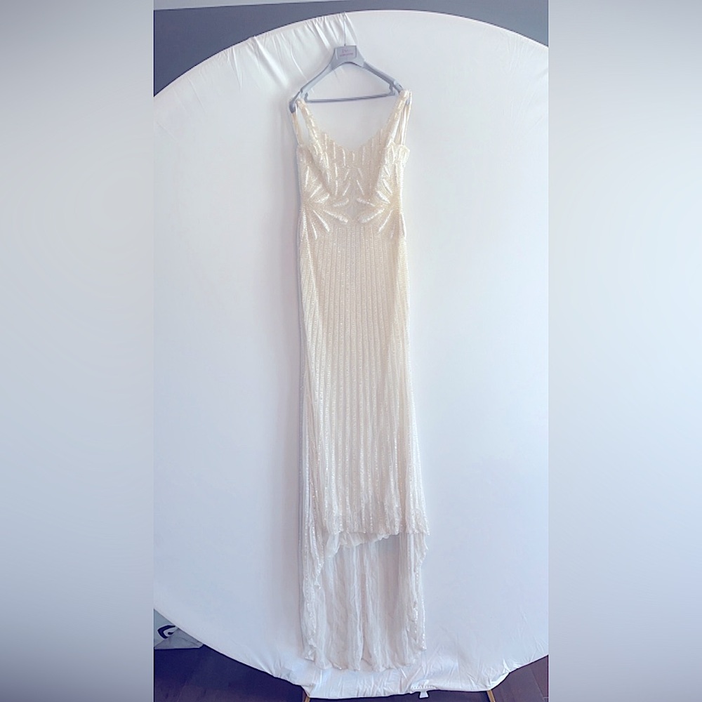 Beautiful glass beaded dress worn once.Comes from a clean and smoke free home.